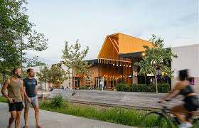 Group pf people walking outside of a commercial building